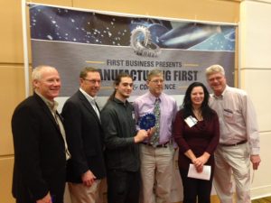 Six people standing in a line accepting a Brighter Image Award